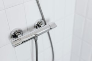 stainless steel pipe on ceramic wall