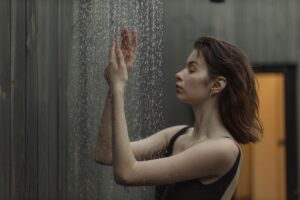 side view of a woman taking a shower