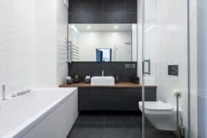 stylish bathroom with bathtub and shower cabin