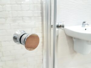 photo of opened door of bathroom